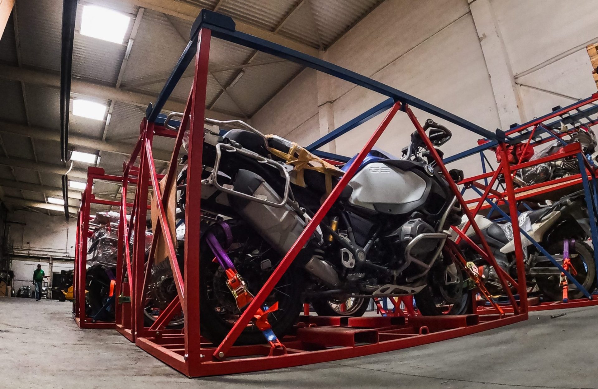 Motorcycles prepared for transport in MotoBirds cages