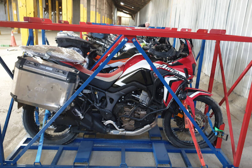motorcycle packed in a cage for the shipment