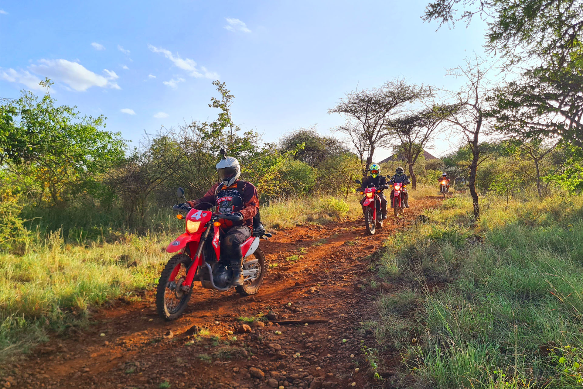 motorcycle tour to Africa Tanzania biker giraffe