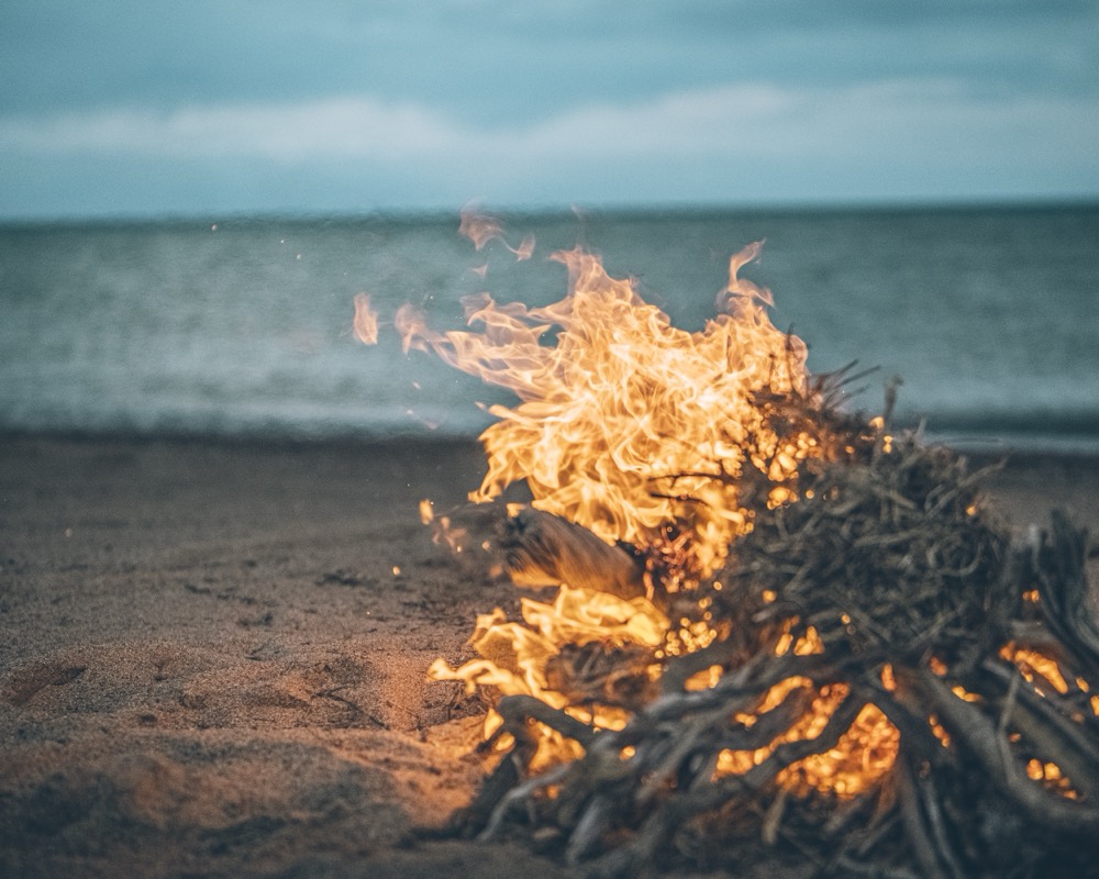 Campfire at a MotoBirds motorcycle expedition camp